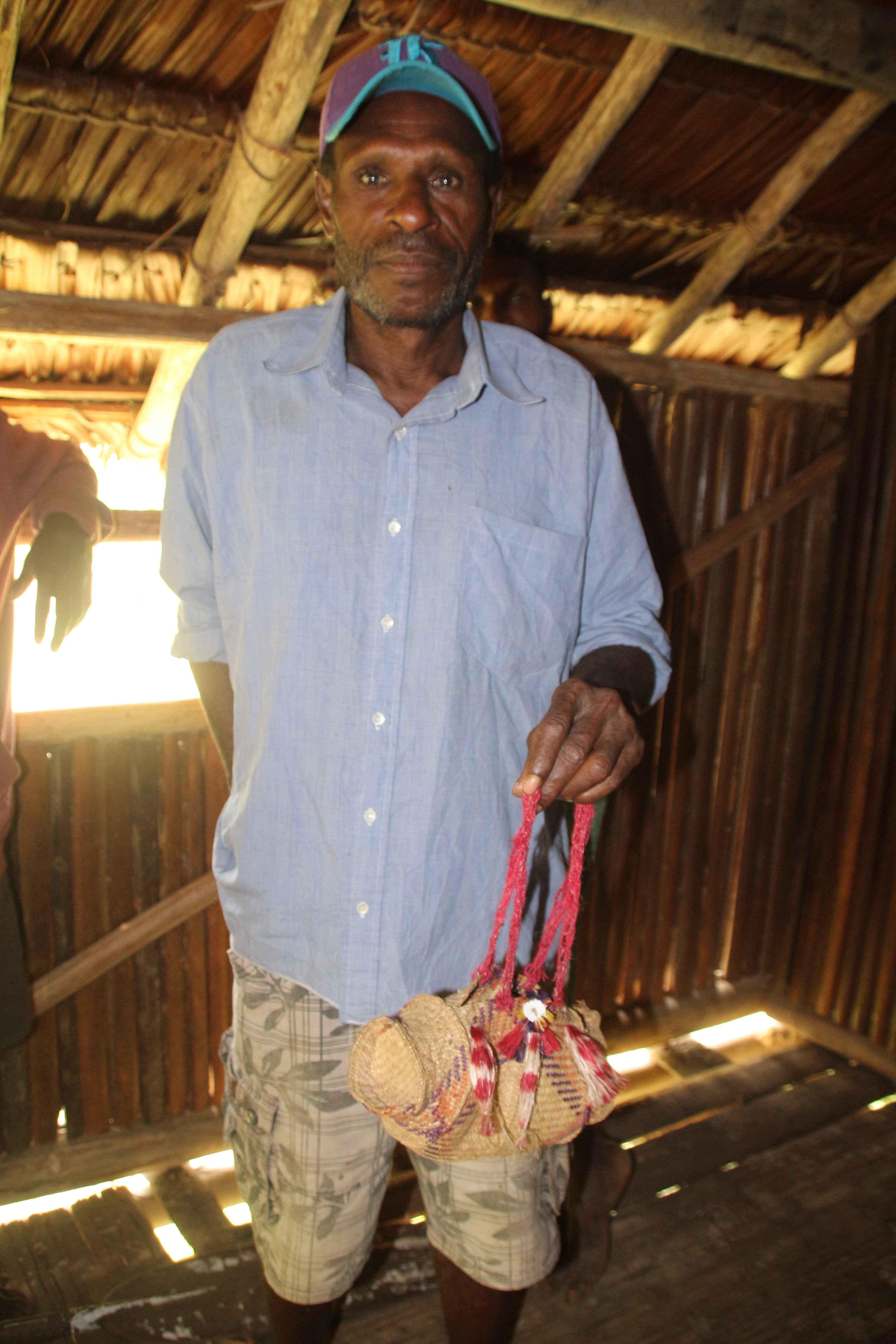 A traditional small purse made out of all natural plant life from the Sepik river. I was giving this with a fresh dropped mango first of the day which they say is a lucky mango.